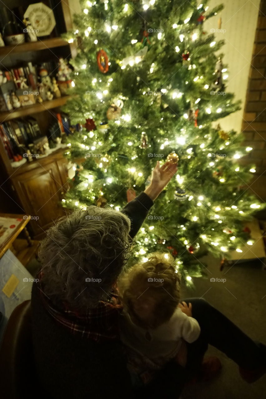 Christmas in Damascus. Grandma showing Granddaughter all of the special ornaments.