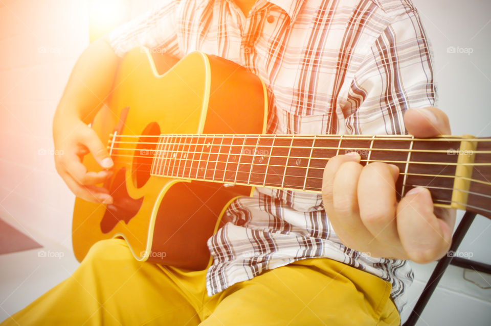 A man playing classic guitar