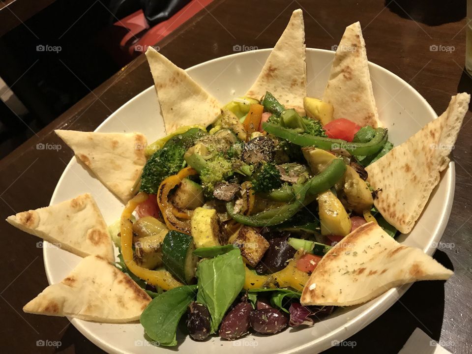 Greek salad with grilled veggies and pita bread 