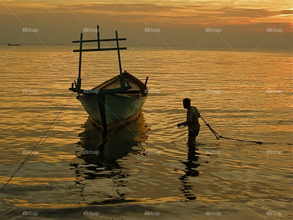 cambodia kampot fisherman and boat by capataziphone