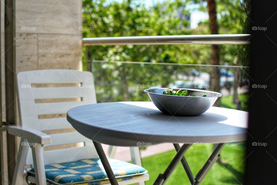 Having a break to eat my salad on the balcony