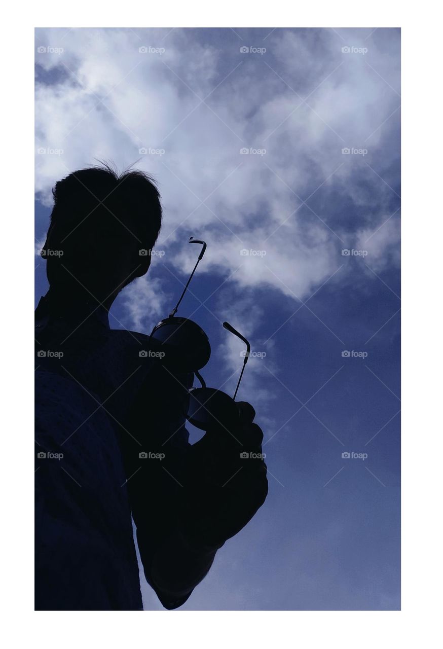 A men Looks in the sky blue sky like a deep thinking 🤔🤔