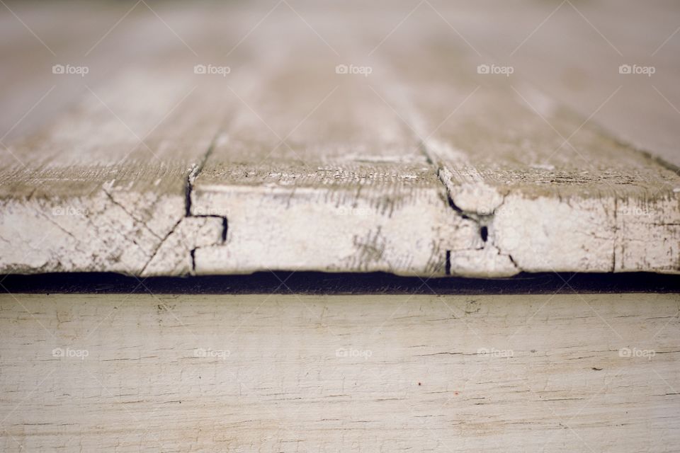 Minimalistic Snaps - edge of outdoor white weathered floor boards showing tongue and groove detail