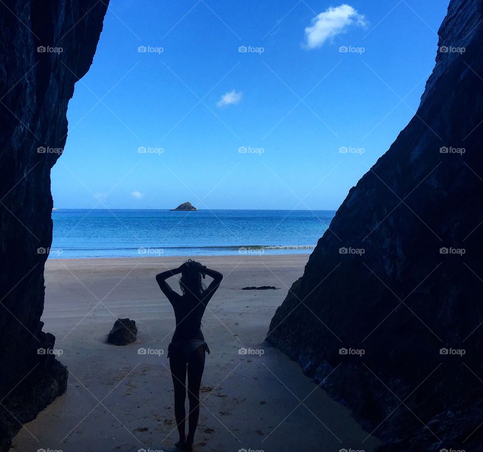 Silhouette of woman standing at beach