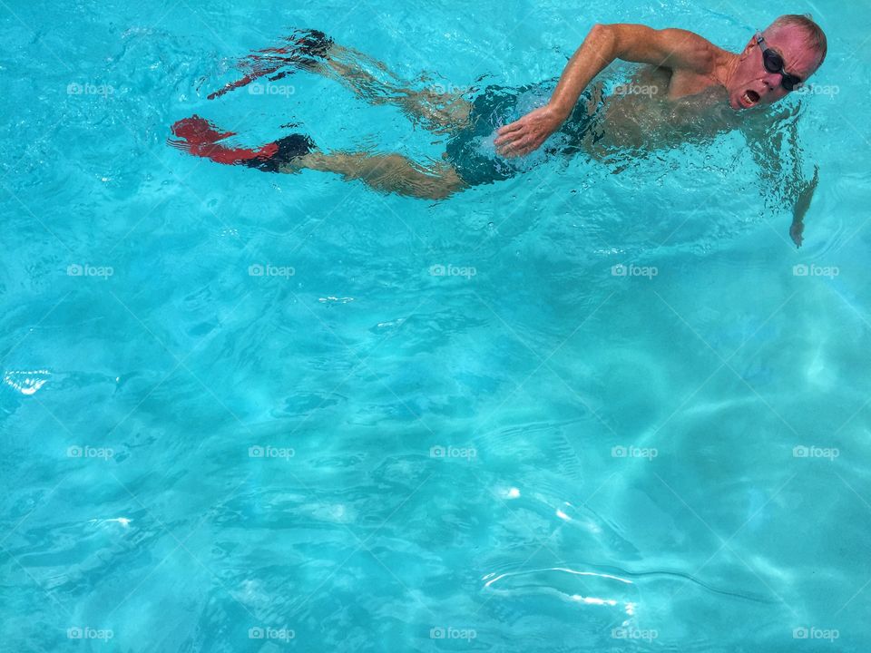 High angle view of mature man in swimming pool