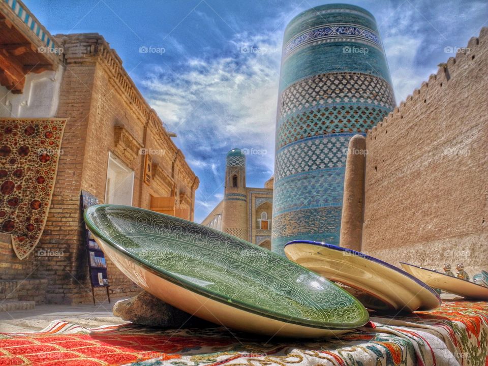 Plates and minarets. . This is in Khiva, Uzbekistan. I bought one of those plates. Then I saw this view and pushed the button. 