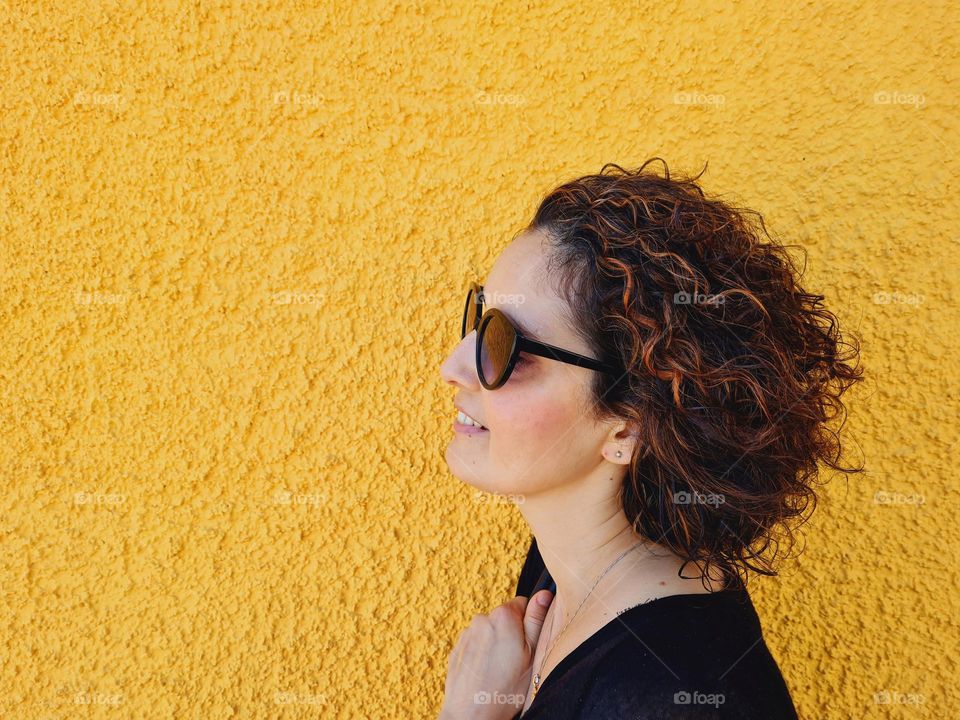 profile woman with short curly hair and meshes