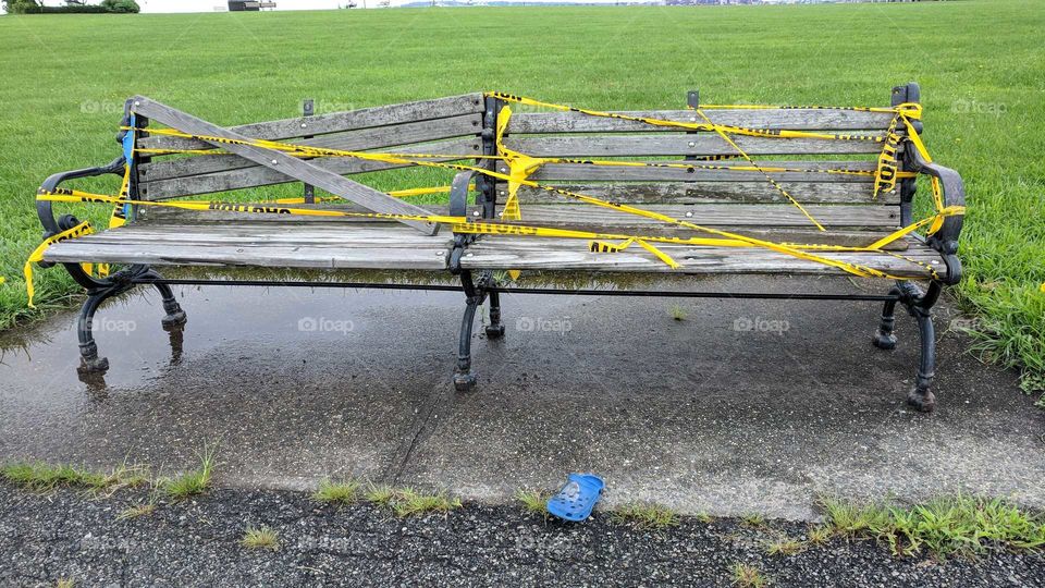 Sad broken bench with missing child's shoe