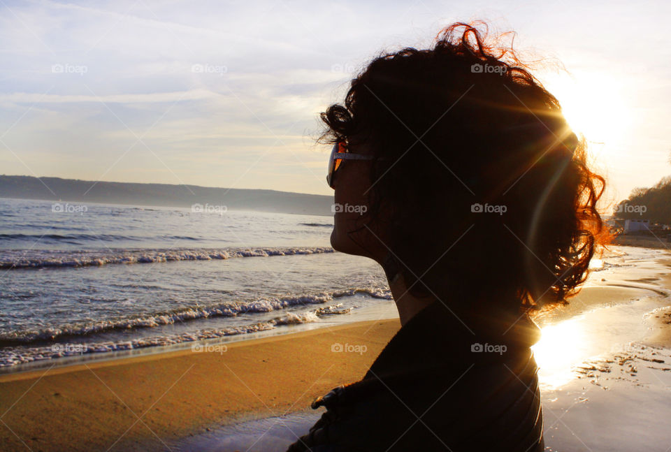 Silhouette of a woman, watching the sea