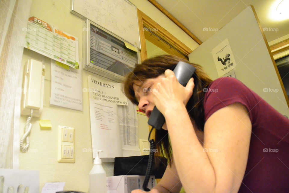 Woman at work . Frustrated in phone. 