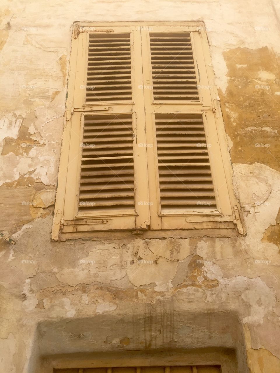 Windows around the world. Shuttered window of a derelict house in Senglea, Malta. 