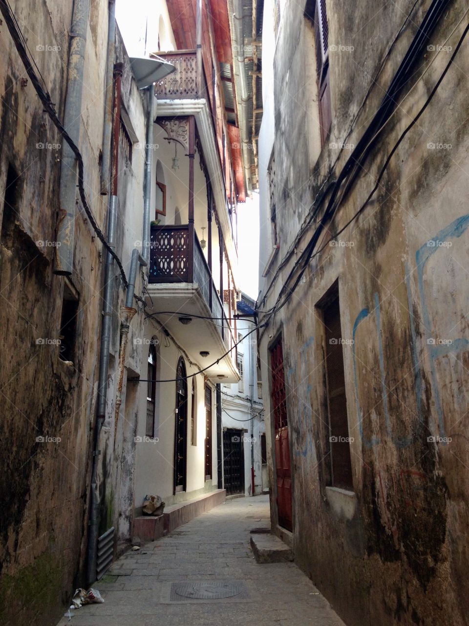 Sparse light shines into Stonetown’s alley ways