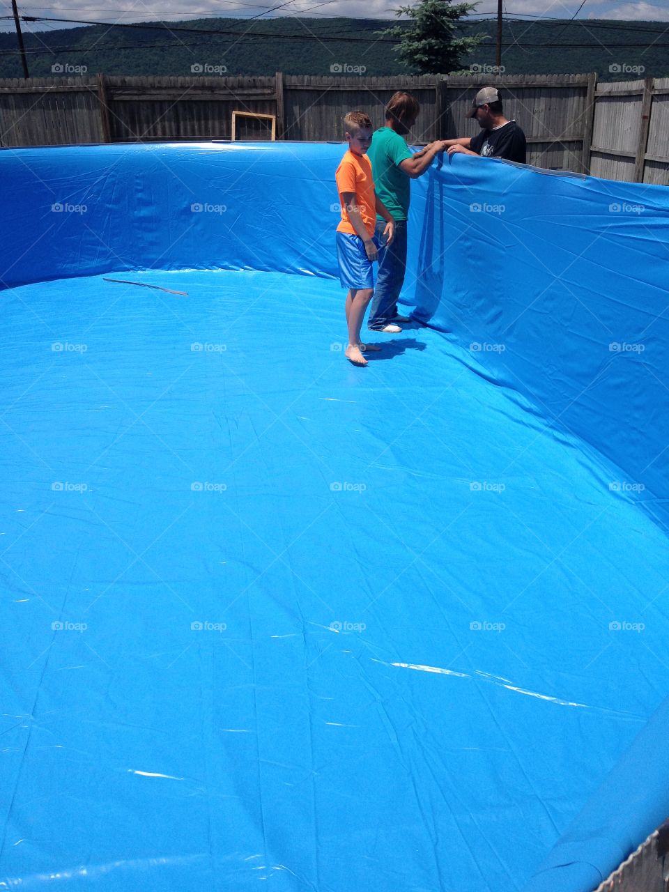 Installing a pool liner. Installing a liner in a 15x30 swimming pool