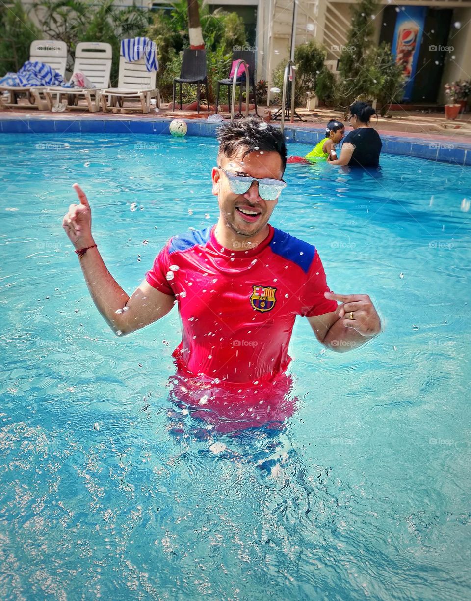 Men Enjoying in Swimming Pool