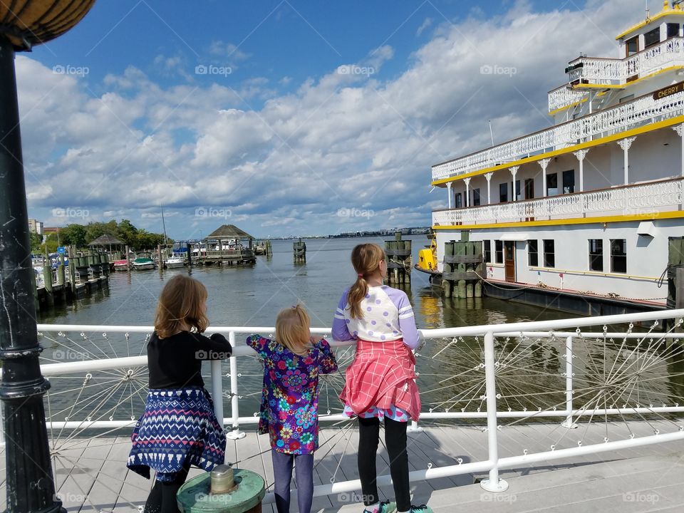 Kids look at a riverboat