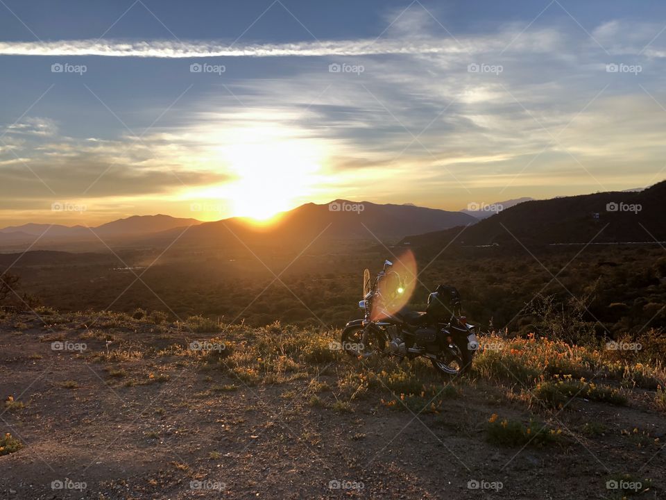 motorcycle route in the desert, sunset