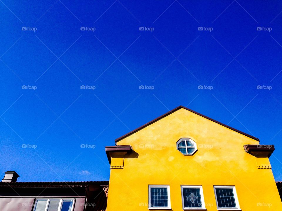 yellow house, blue sky