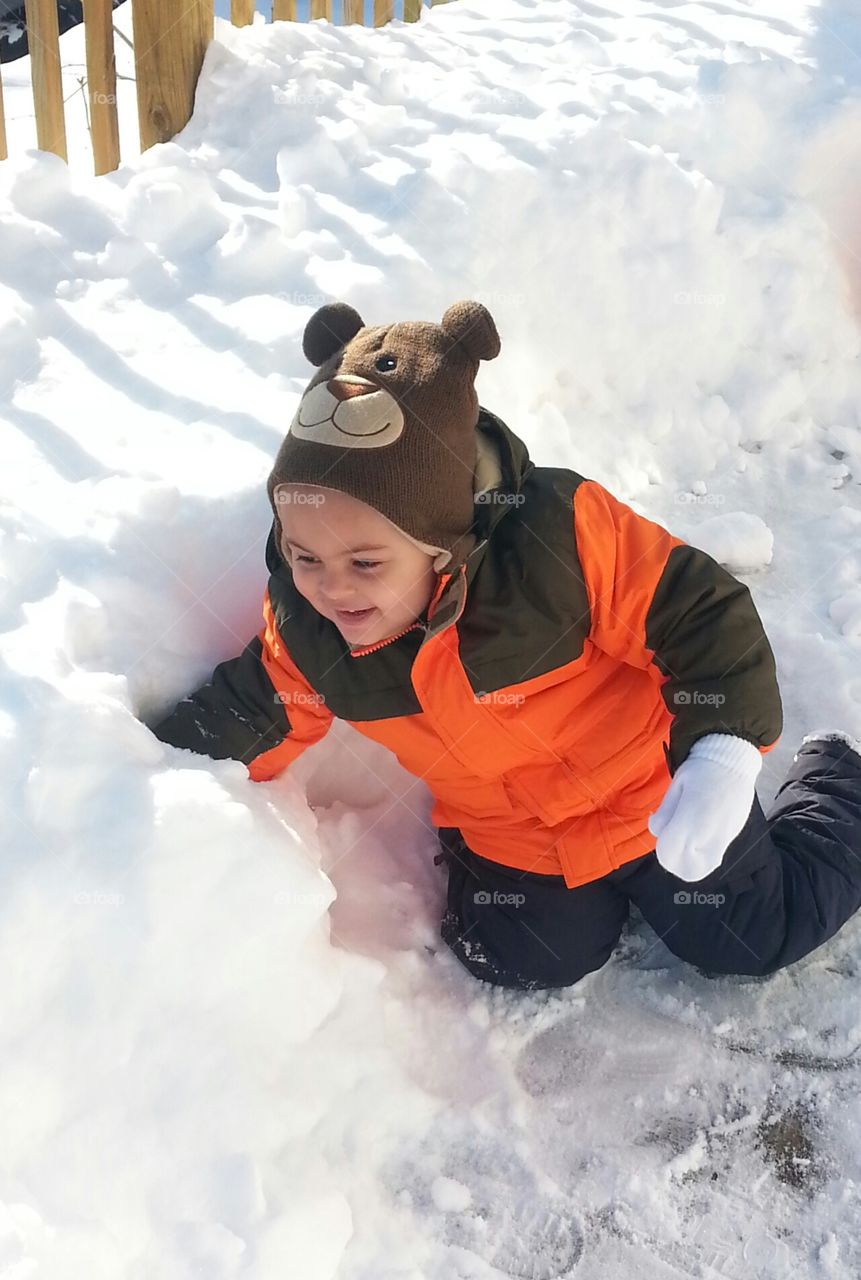 Wintet Play. toddler playing in snow