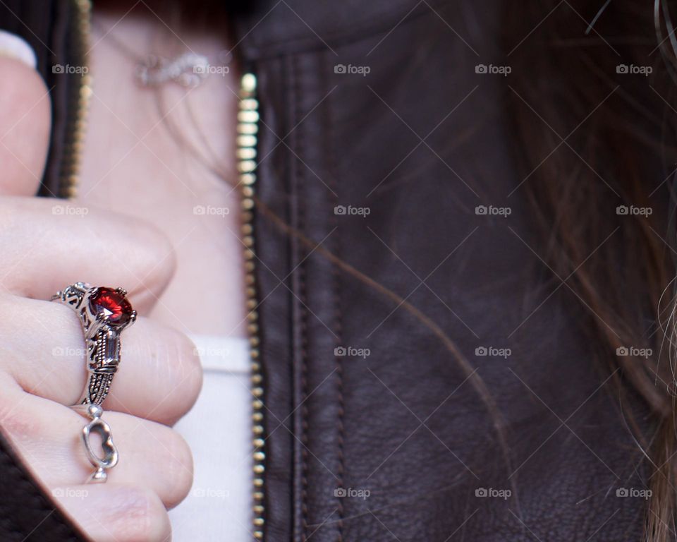 Red Ruby and Heart rings with an infinity necklace in the background 