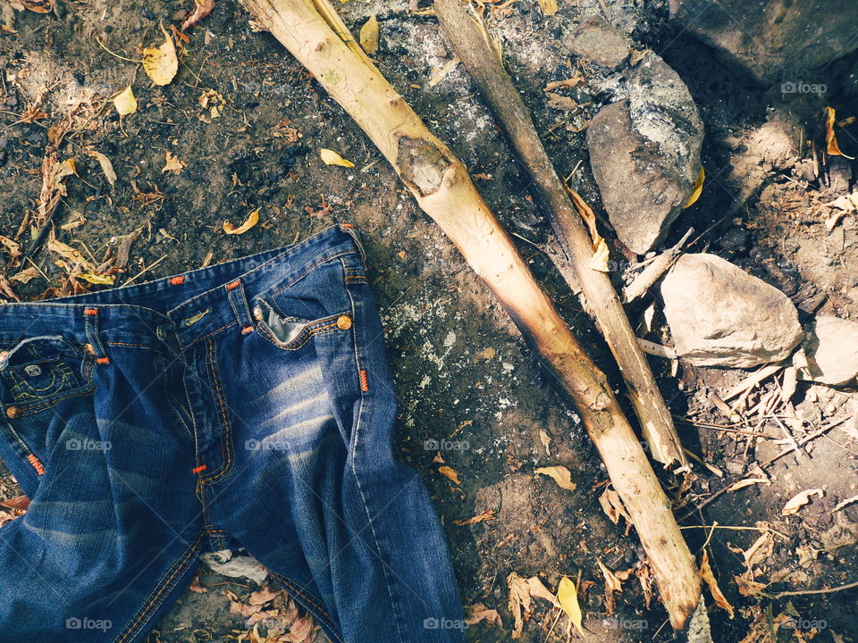 jeans lie near the extinct fire