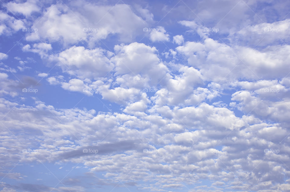 The beauty of the sky with clouds and the sun.