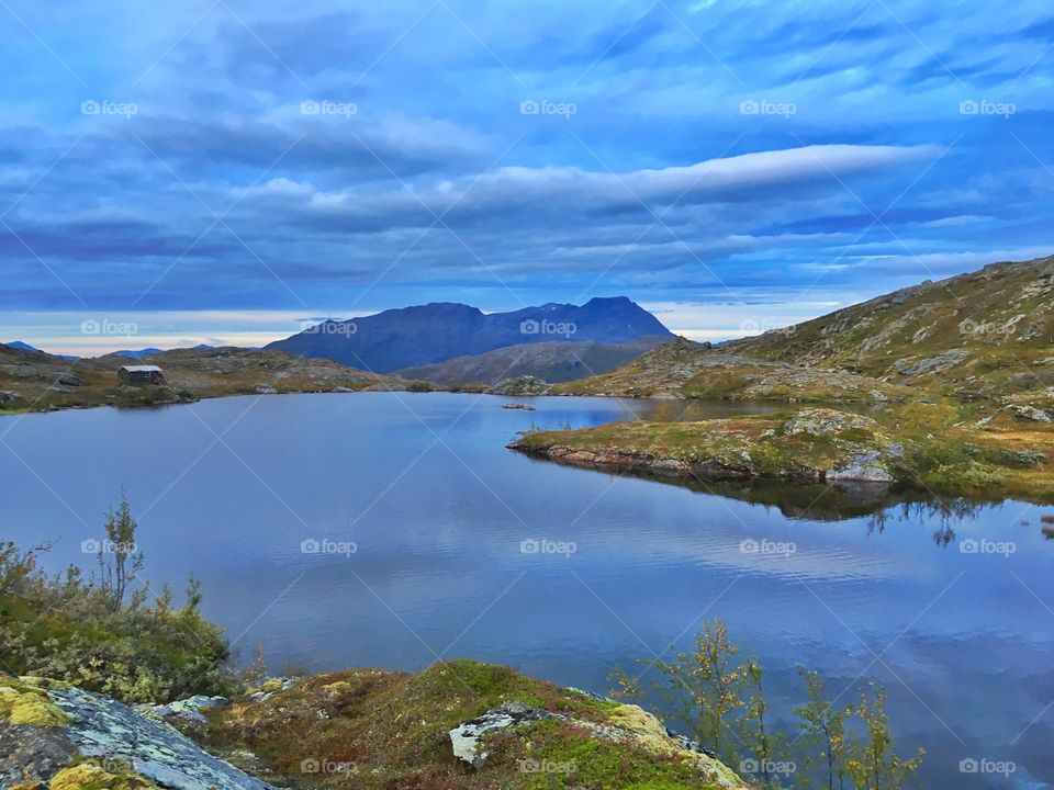 Blue lake against blue sky