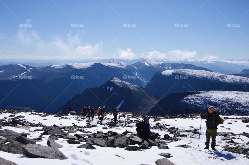 Photo of a people hiking in the mountains 