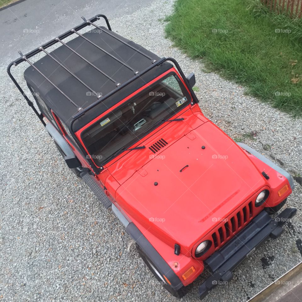 Areal view of a red Jeep Wrangler.
