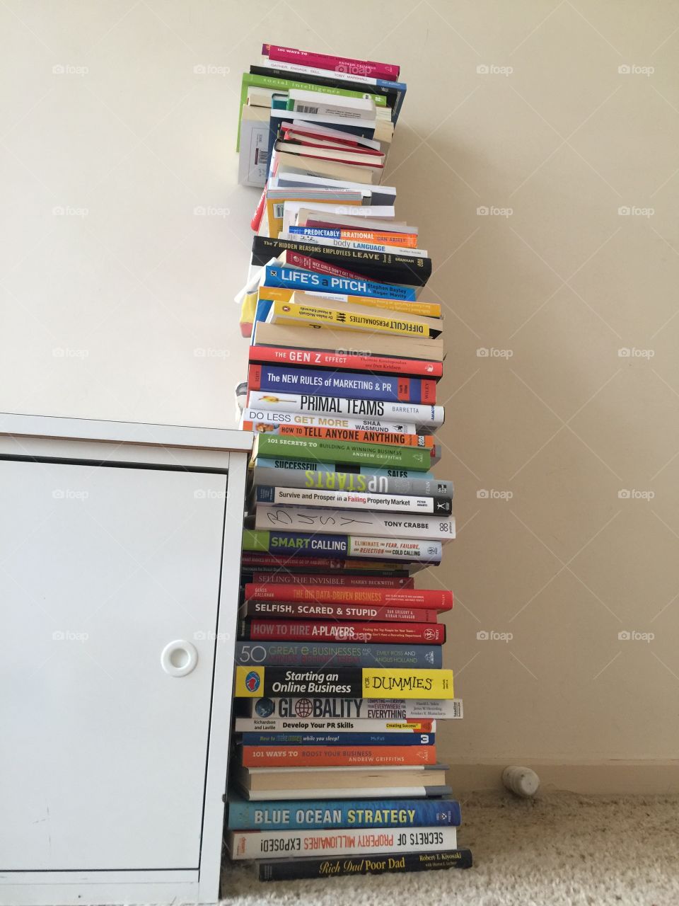 Tall stack of business books