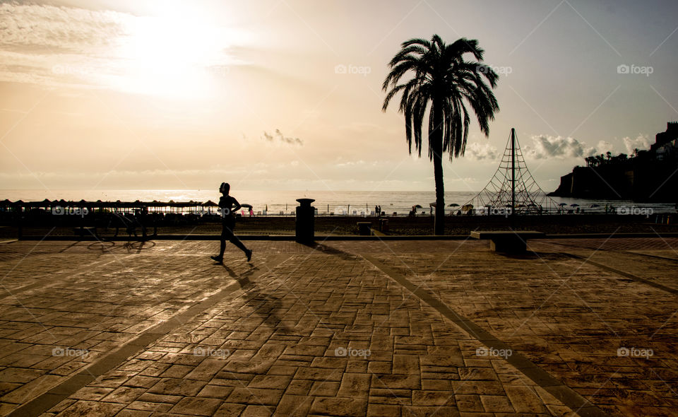 Sport on the beach at sunrise