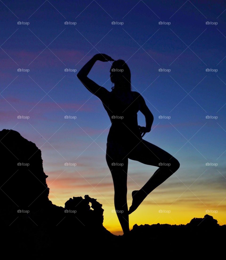 Yoga silhouette at sunset on the beach in Perth Western Australia 
