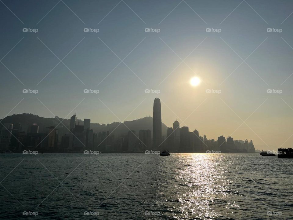 Sun shining the Victoria Harbour in Hong Kong