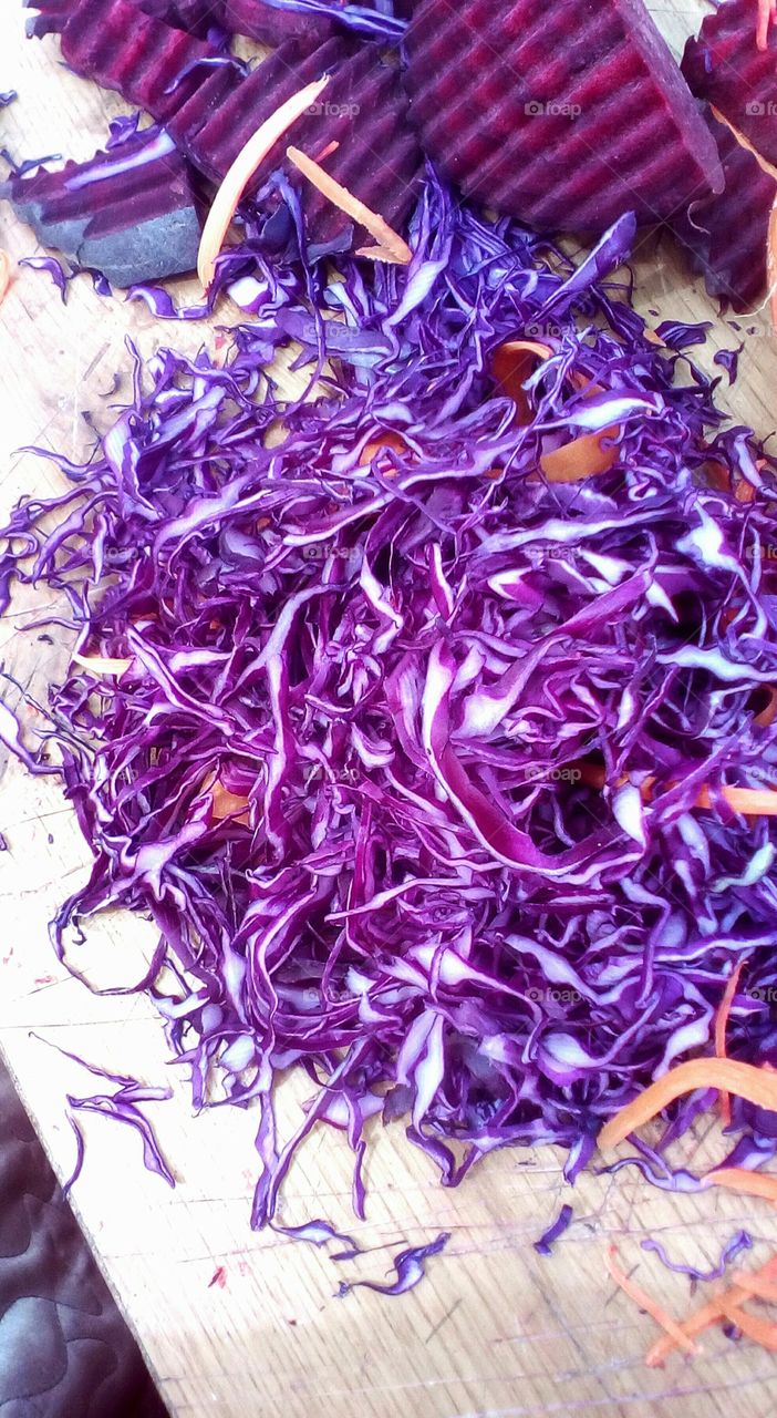 Cutted red cabbage on wooden table