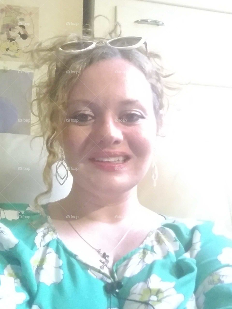 Beautiful confident curly haired woman hanging out by herself.