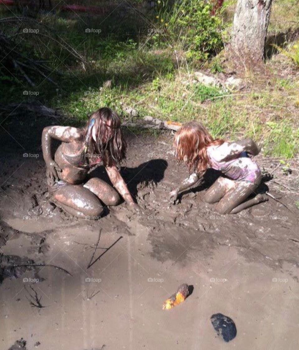 Girl playing in the mud