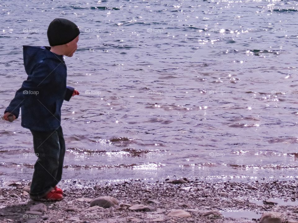 Throwing rocks in the lake!