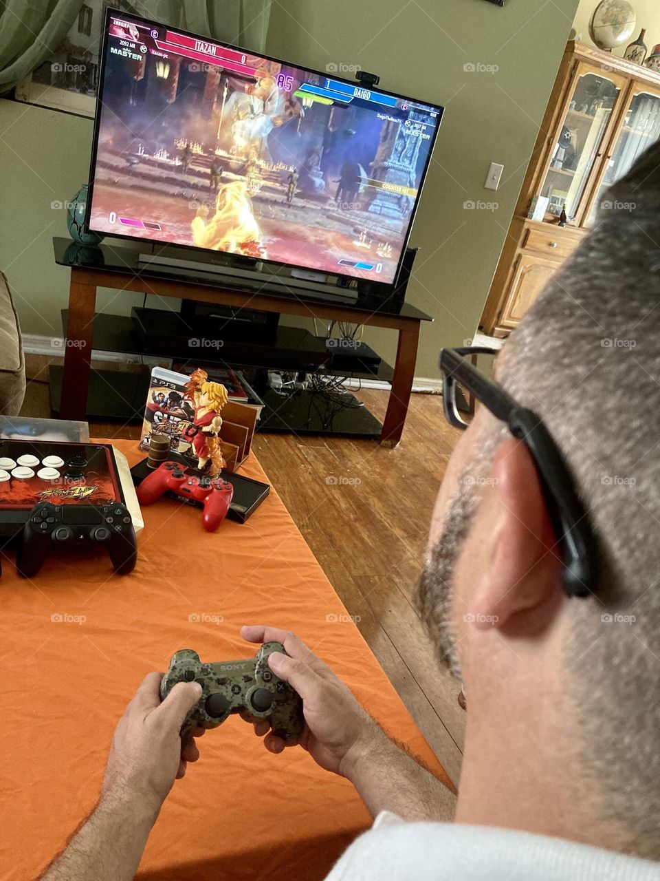 Man playing street fighter video game photography mission 