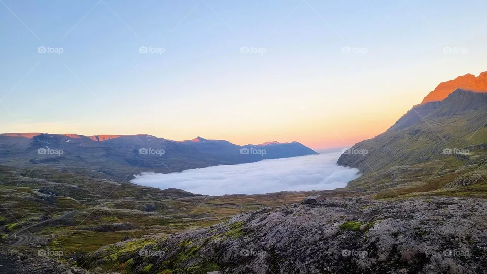 Misty valley at sunset