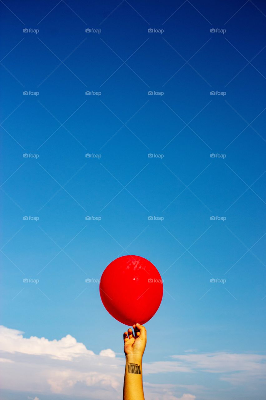 red balloon held