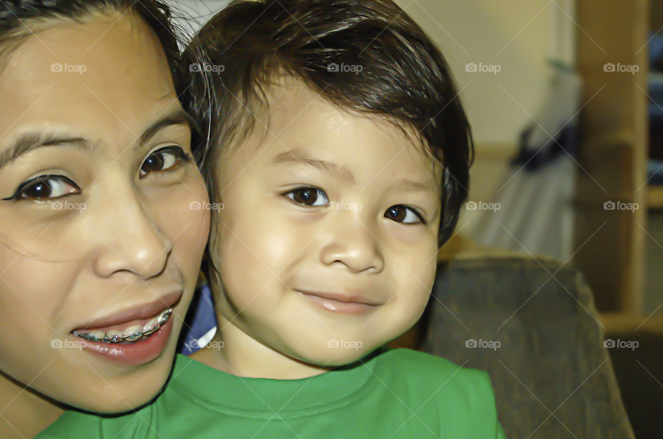 Portrait of mother and son are smiling happily.