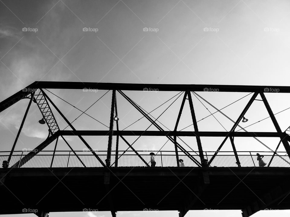 The architecture of an old bridge incorporates triangles of various sizes.