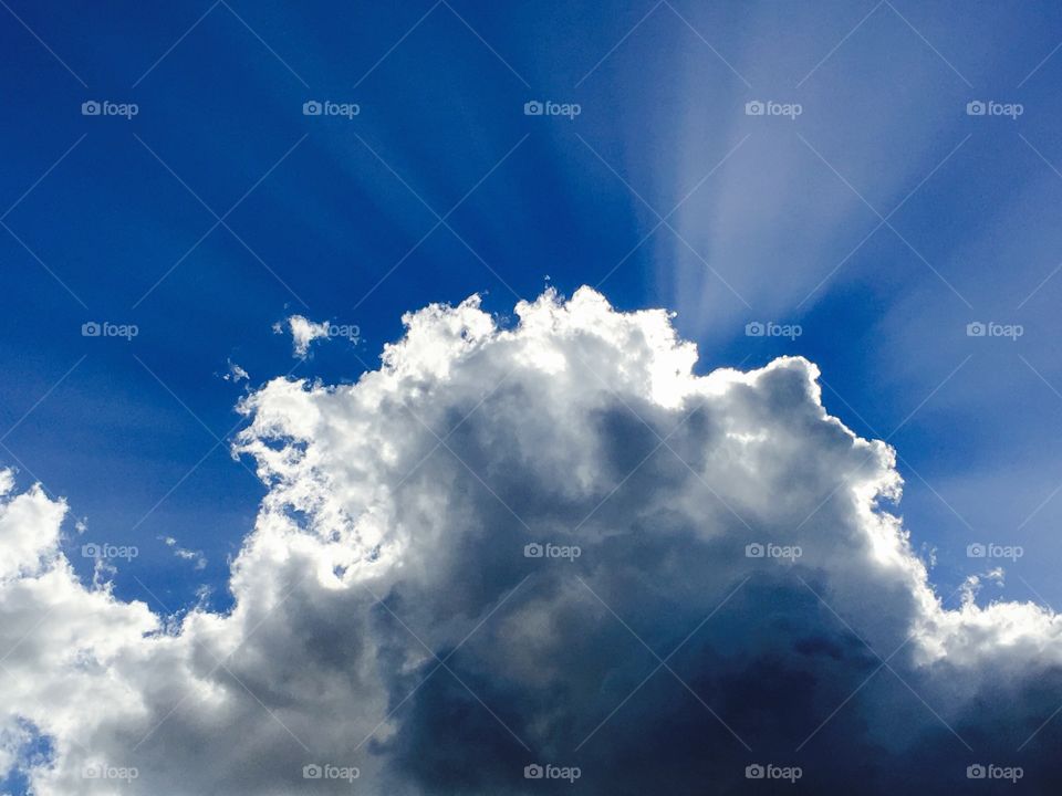 Sun shining from behind the clouds