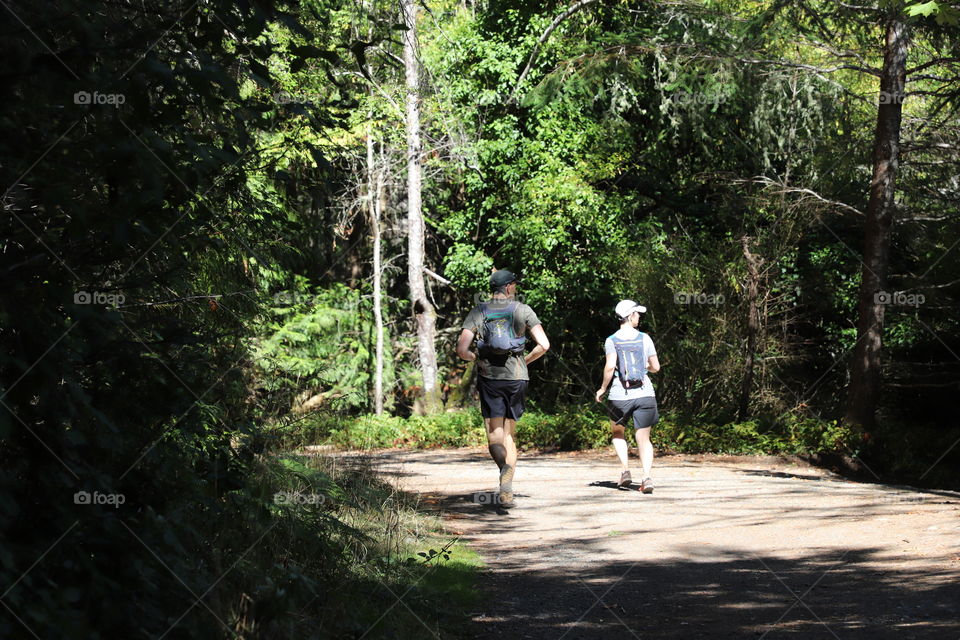 Runners in the woods