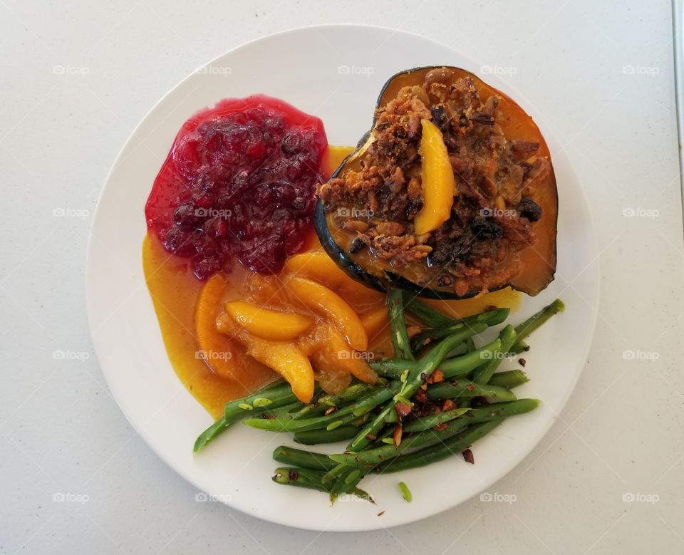 On the Plate.
Healthy vegetarian Thanksgiving meal - stuffed acorn squash (to die for), curried peaches, cranberry sauce, and green beans w/ toasted almonds.
