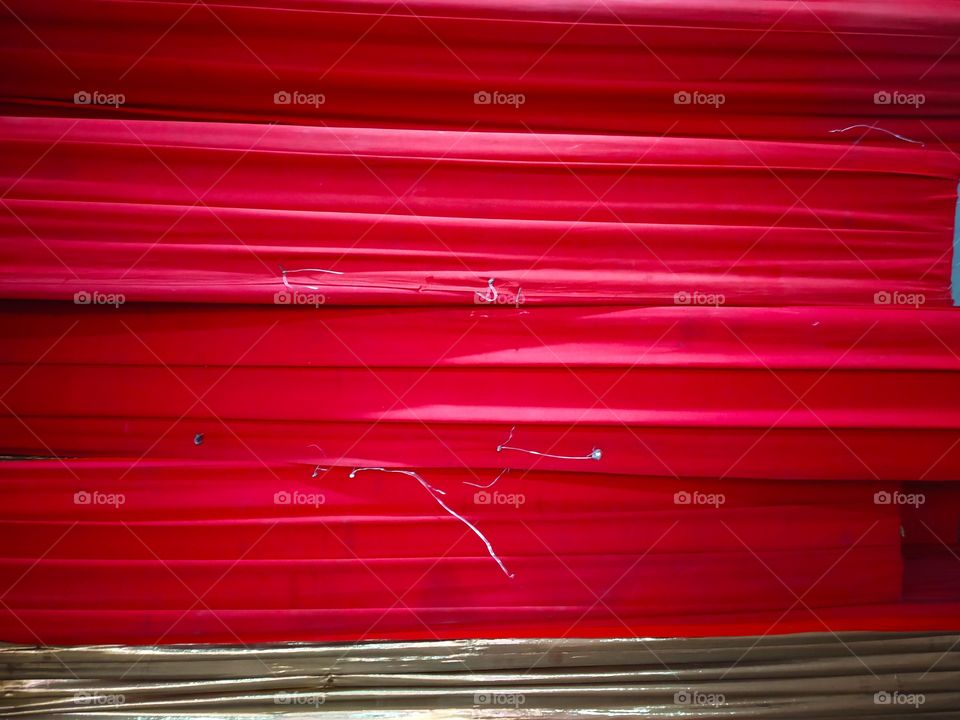 Macro of beautiful shiny red satin ribbon background