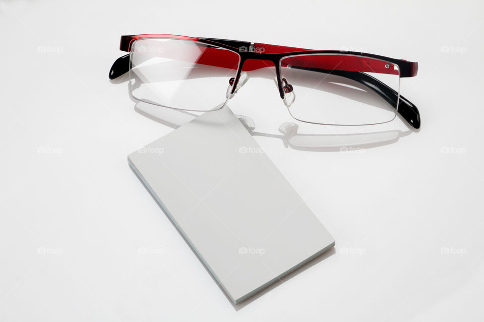 Blank white business cards and eye glasses