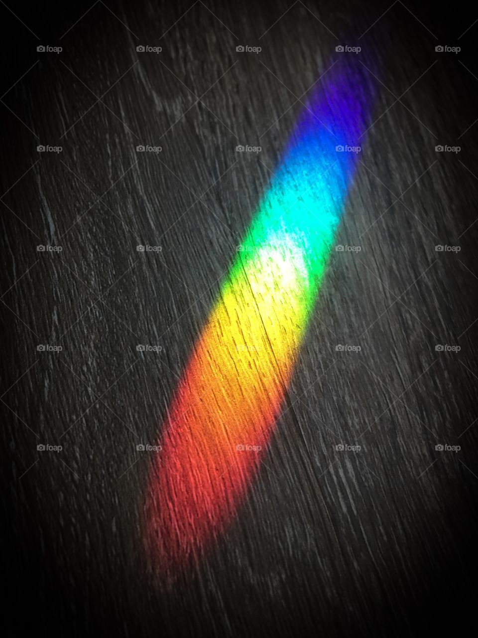 Beautiful rainbow made from road totem hanging in window 