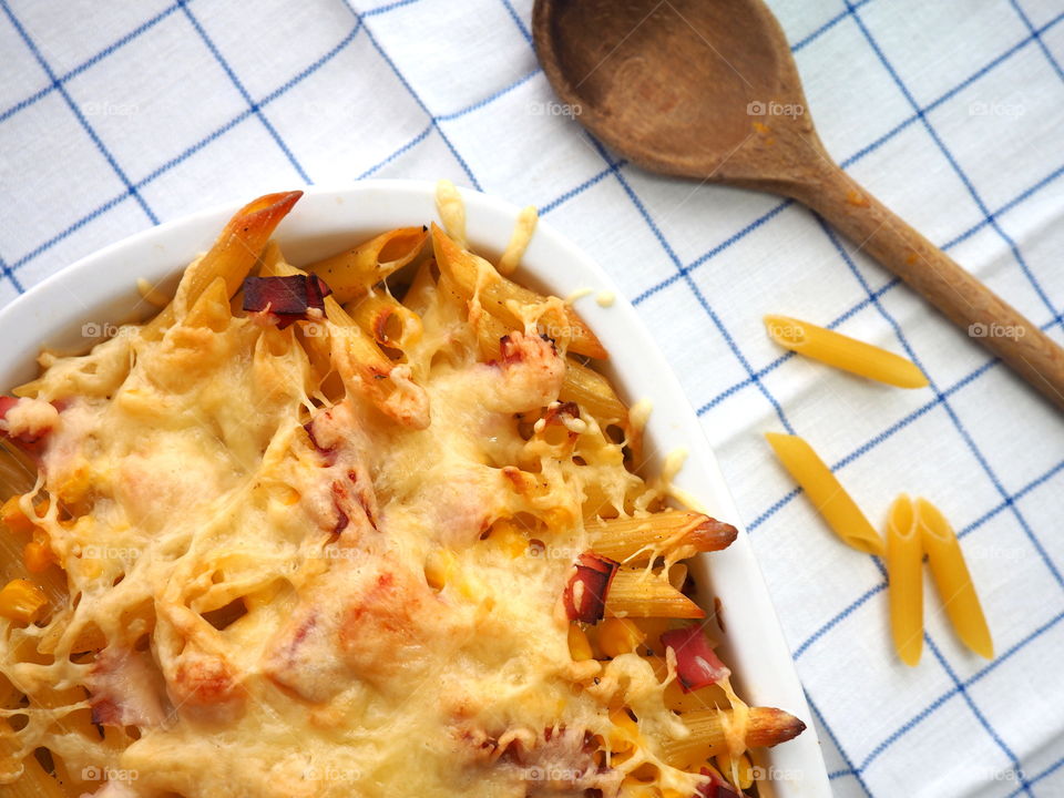 close up of fresh and homemade pasta with cheese and vegetables