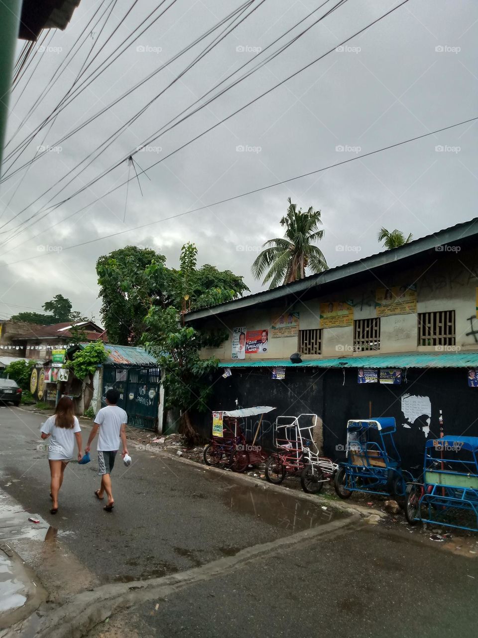 AFTER AN ON AND OFF, SLOW TO HEAVY RAIN THE WHOLEDAY , CLOUDY WEATHER IS STILL ON,, LEAVING THE STREET WET