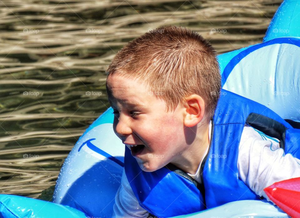 Boy Playing In Water